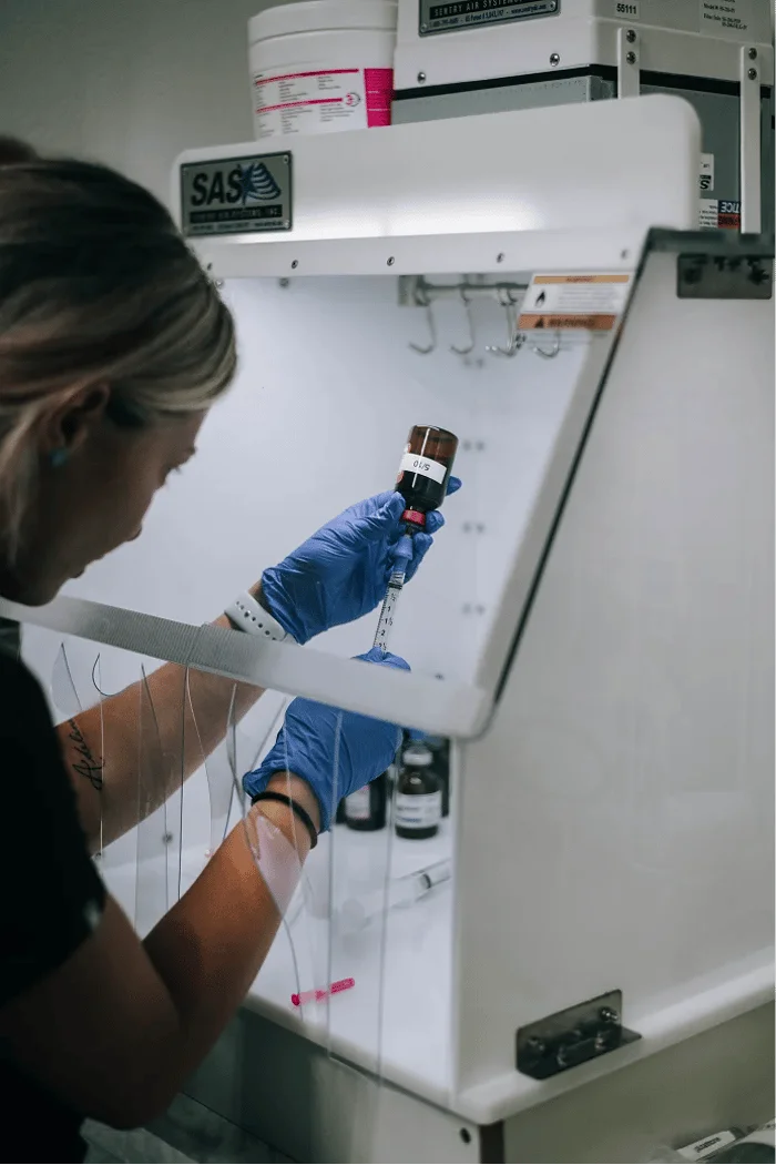 Two medical professionals reviewing blood samples during a lab consultation
