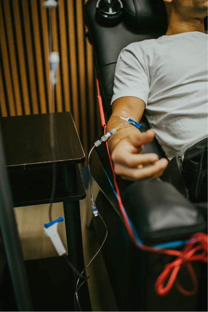 Clinician preparing NAD+ IV infusion in the InnerWorks treatment lounge