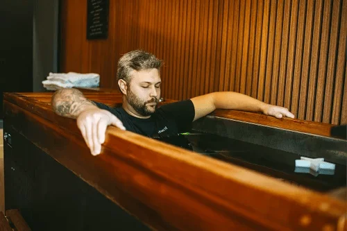 Bearded man enjoys a cold plunge for healthcare.